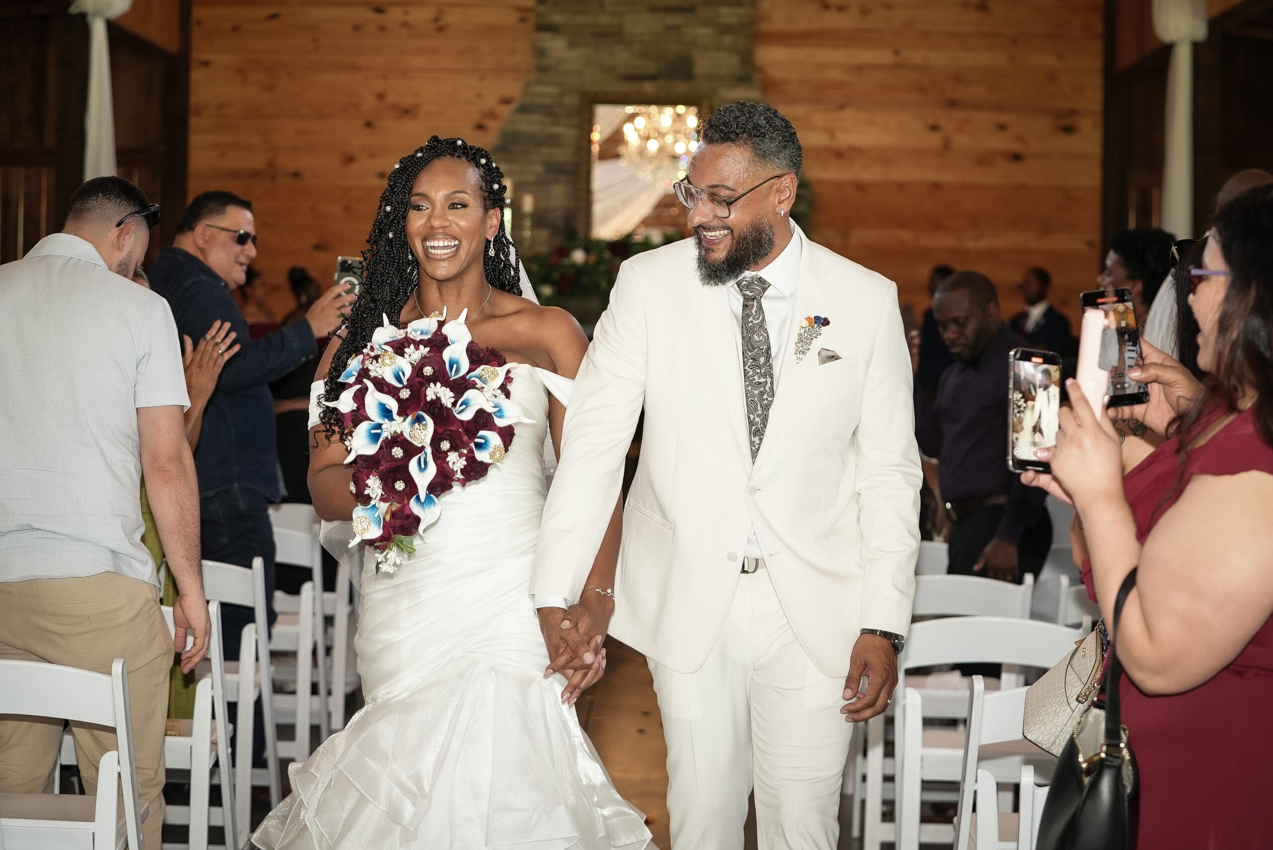 Happy newlyweds walking down the aisle at their wedding ceremony.